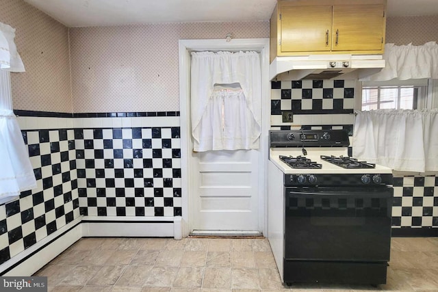 kitchen with black gas range oven