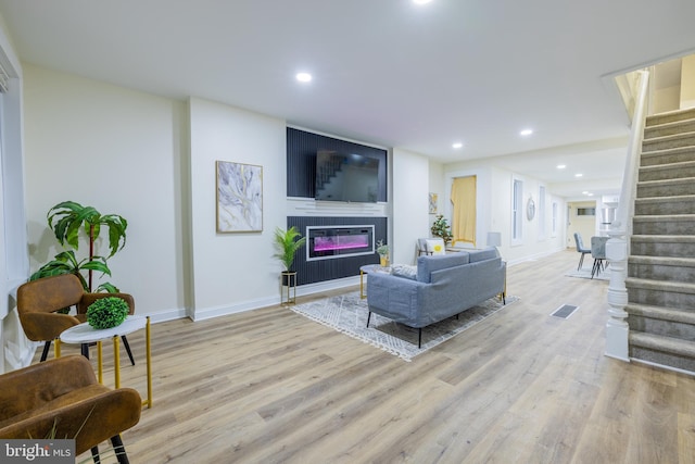 living room with light hardwood / wood-style floors