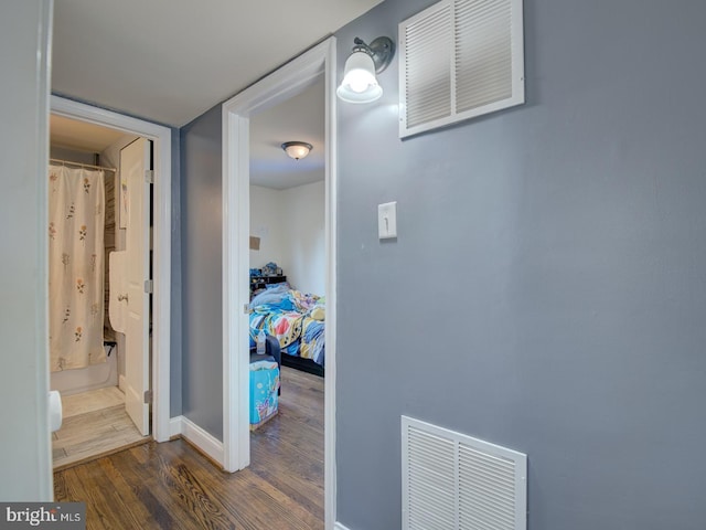 hallway featuring dark hardwood / wood-style floors