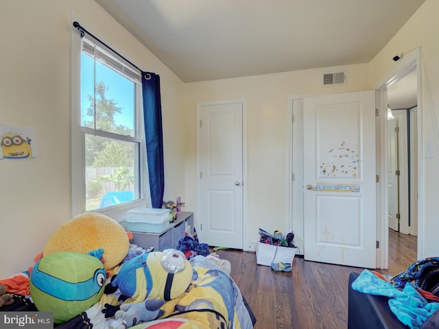 bedroom featuring dark hardwood / wood-style floors