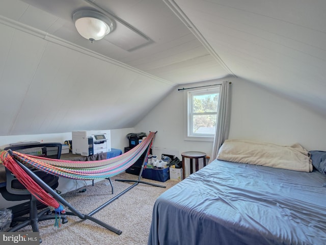 bedroom featuring carpet floors and vaulted ceiling