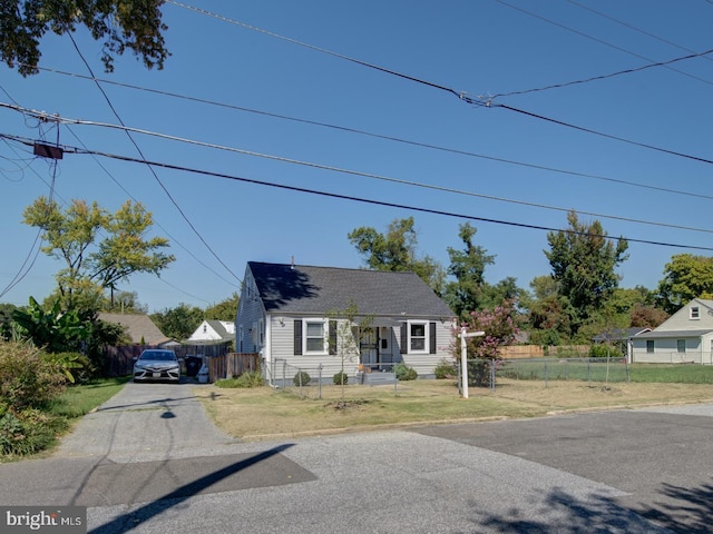 bungalow-style home with a front lawn