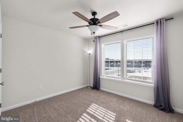 carpeted empty room featuring ceiling fan