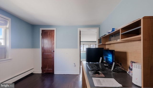 office space with baseboard heating and dark wood-type flooring