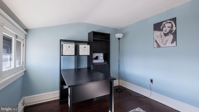 home office featuring vaulted ceiling and dark wood-type flooring