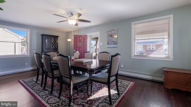 dining area with a baseboard radiator, ceiling fan, and dark wood-type flooring