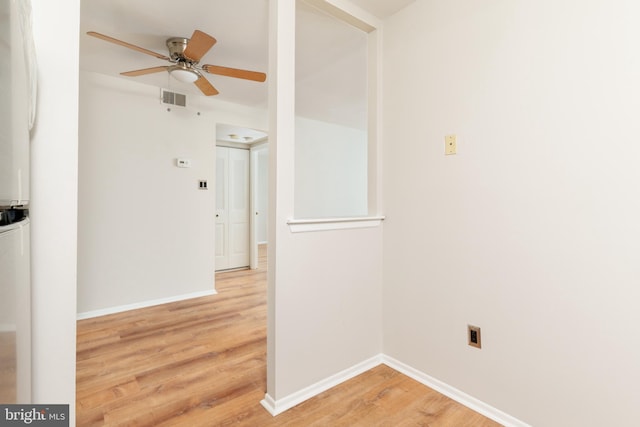 unfurnished room featuring ceiling fan and hardwood / wood-style flooring