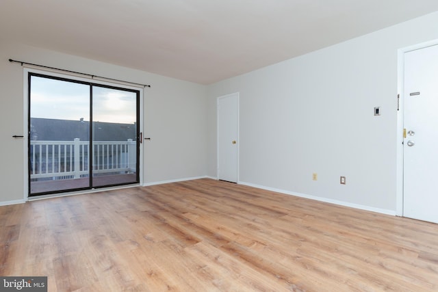 spare room with light wood-type flooring