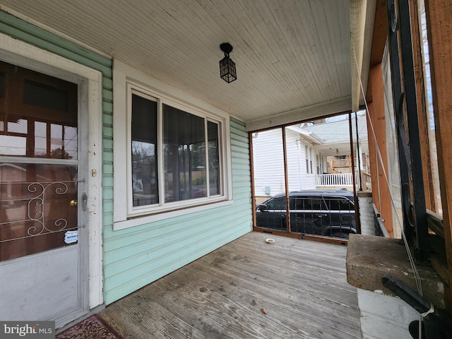 wooden terrace featuring a porch