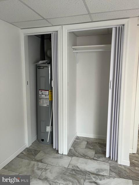 utility room featuring electric water heater