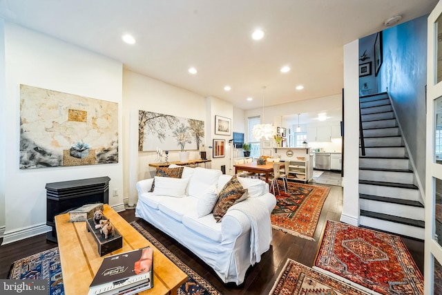 living room featuring dark wood-type flooring