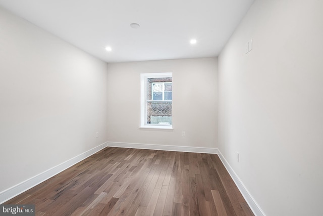 spare room with hardwood / wood-style floors