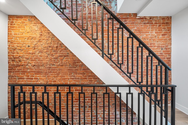 stairway featuring hardwood / wood-style flooring