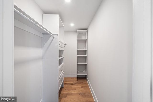 walk in closet featuring light hardwood / wood-style floors