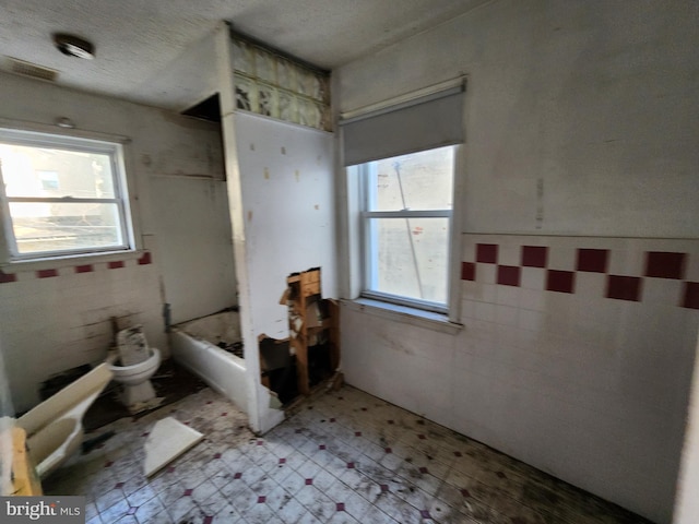 bathroom featuring a textured ceiling