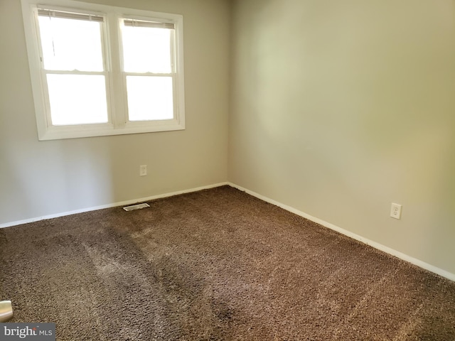 unfurnished room with carpet