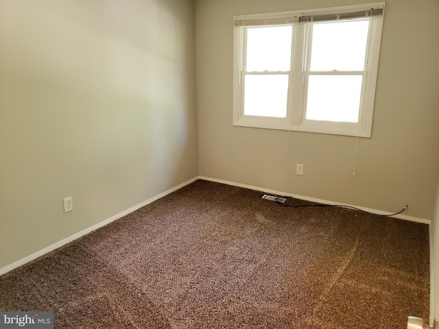 unfurnished room with carpet floors