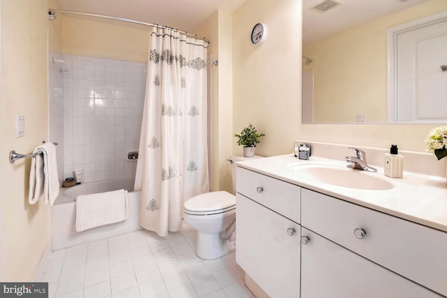 full bathroom featuring vanity, shower / tub combo with curtain, tile patterned floors, and toilet