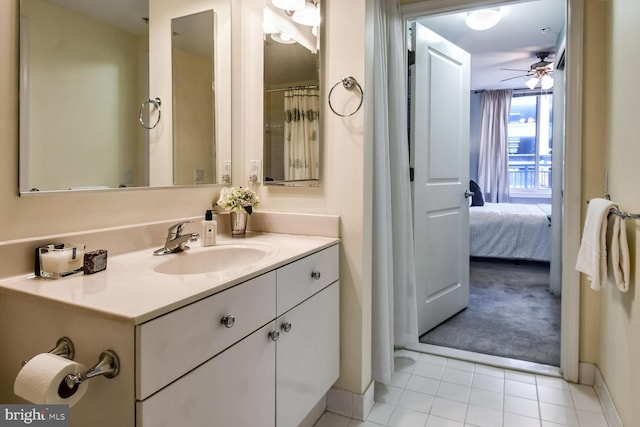 bathroom with ceiling fan, vanity, and tile patterned flooring