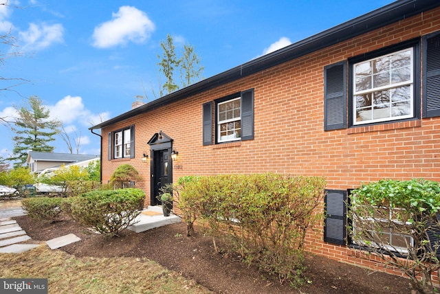 view of front of house featuring brick siding