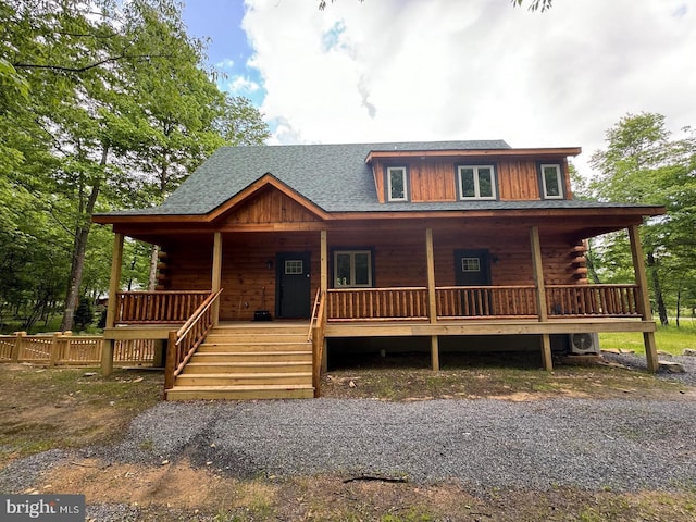 log home with covered porch