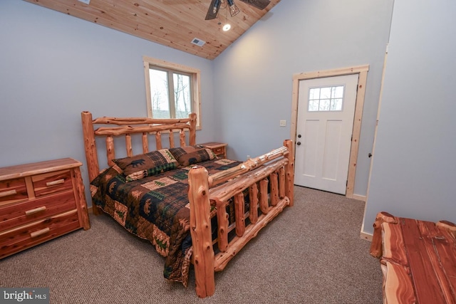 carpeted bedroom with ceiling fan, wood ceiling, high vaulted ceiling, and multiple windows