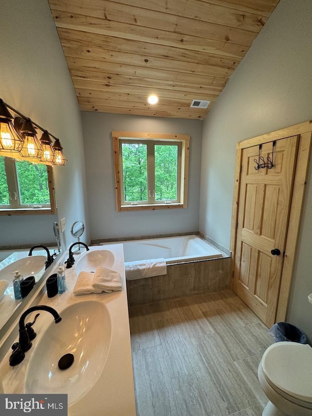 bathroom featuring a relaxing tiled tub, wooden ceiling, vaulted ceiling, and hardwood / wood-style flooring