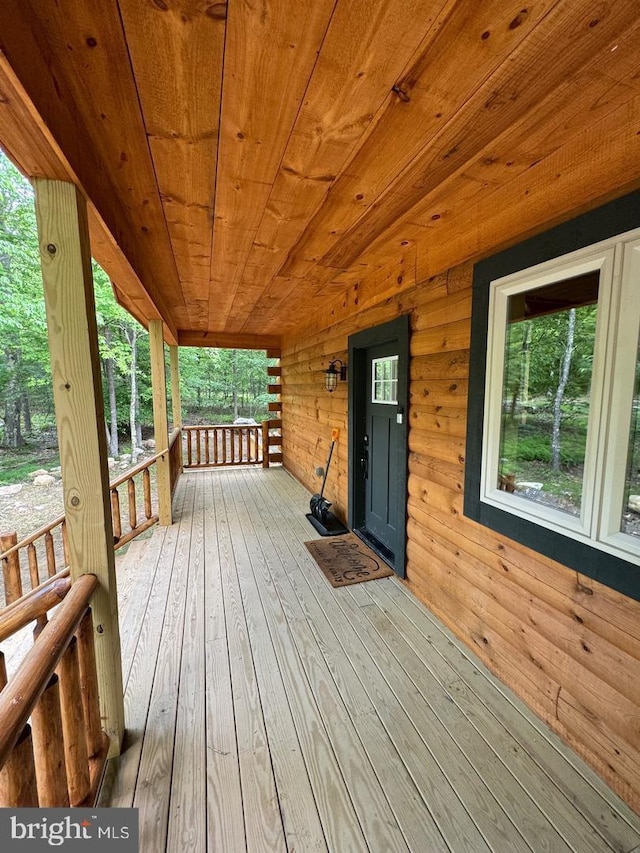 wooden deck featuring covered porch