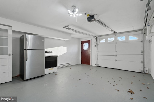 garage featuring a garage door opener, baseboard heating, and stainless steel refrigerator