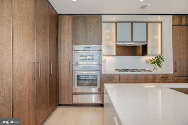 601 Wharf SW Unit 1007, Washington, DC 20024 - kitchen with stainless steel appliances and light hardwood / wood-style floors