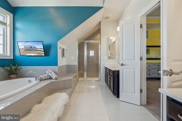 bathroom featuring vanity, tile patterned floors, plus walk in shower, and lofted ceiling