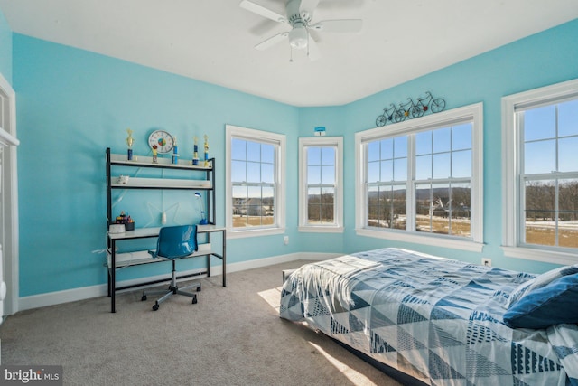 bedroom featuring ceiling fan and carpet floors