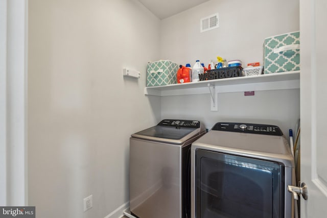 laundry area with washing machine and dryer