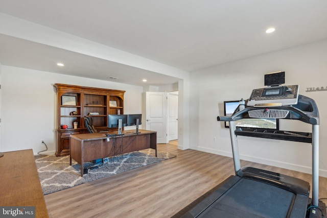 workout area featuring light hardwood / wood-style floors