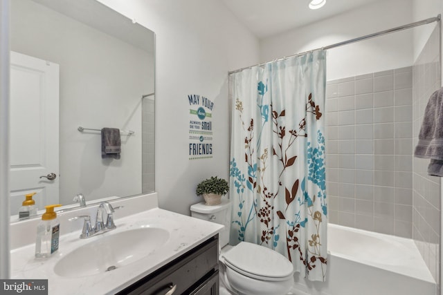 full bathroom featuring shower / tub combo with curtain, vanity, and toilet