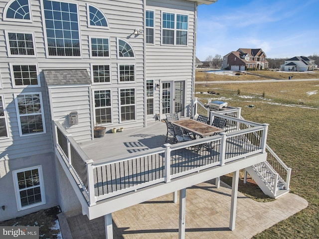 wooden deck with a patio