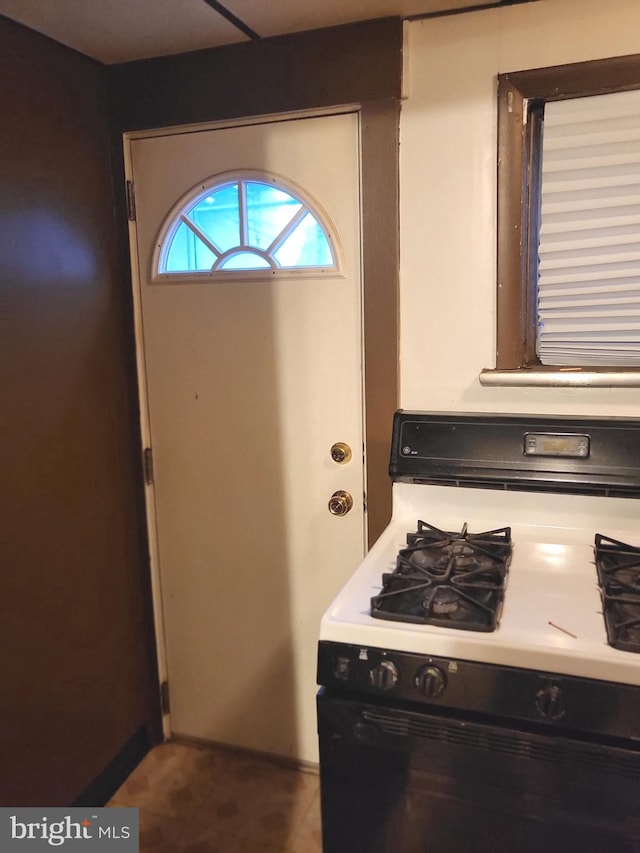 kitchen with white gas stove