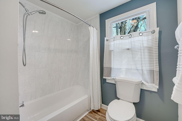 bathroom featuring toilet and shower / bath combo with shower curtain