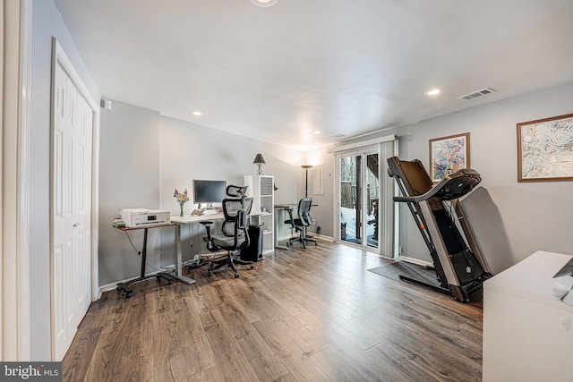 office with wood-type flooring