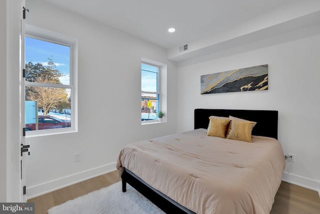 bedroom with hardwood / wood-style flooring