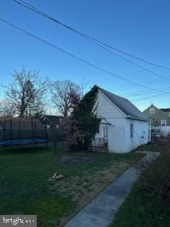 view of side of home featuring a lawn