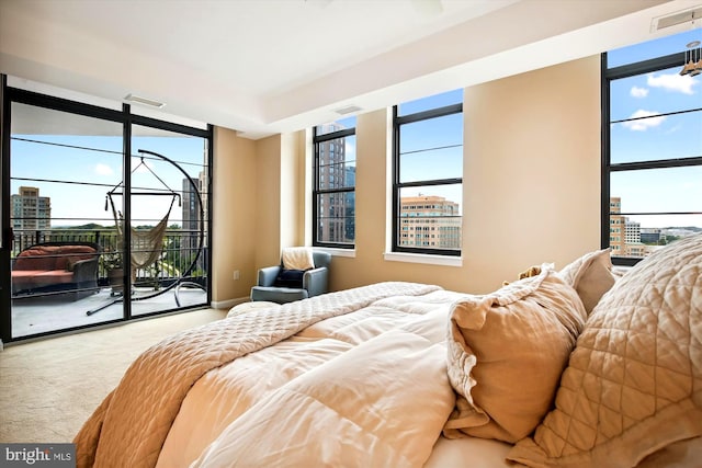 carpeted bedroom featuring access to exterior