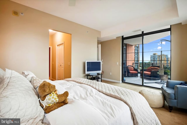 carpeted bedroom featuring access to outside