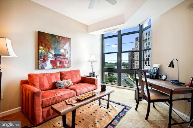 living room with carpet flooring and ceiling fan