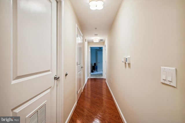 corridor featuring dark wood-type flooring