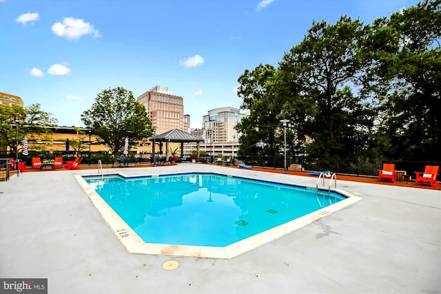 view of swimming pool with a gazebo and a patio