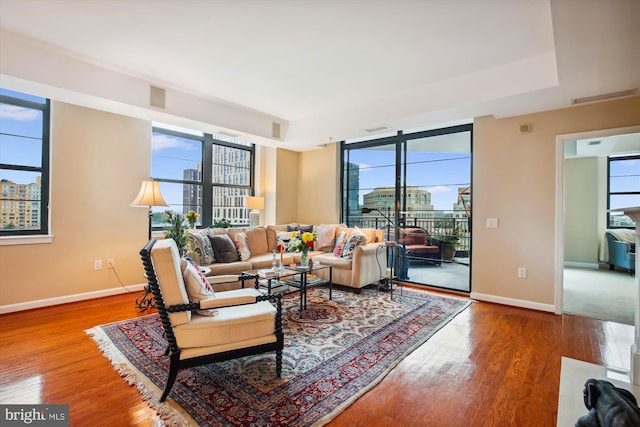 living room featuring a wealth of natural light and wood-type flooring