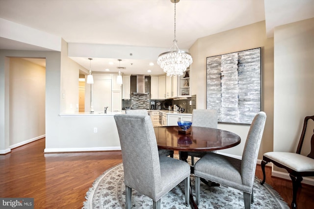 dining room featuring dark hardwood / wood-style floors and a notable chandelier