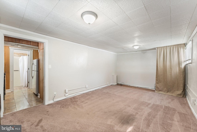 unfurnished room with light carpet