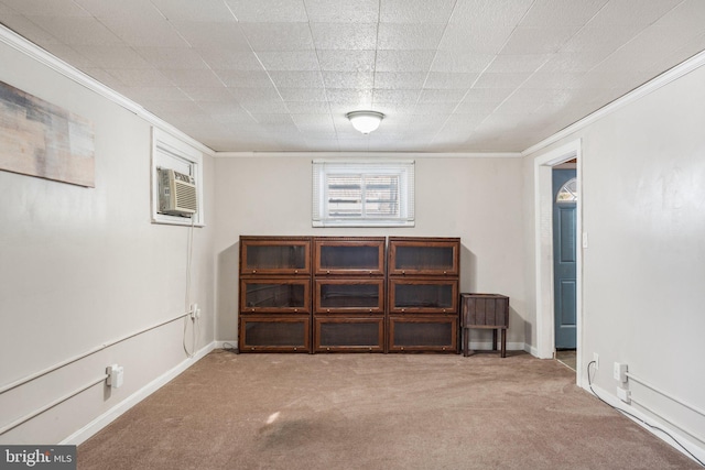 carpeted empty room with a wall mounted air conditioner and ornamental molding